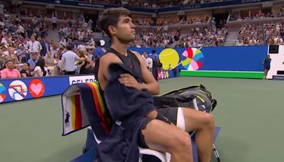 David Ferrer cuddles up to Carlos Alcaraz before the Davis Cup