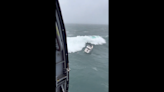 Rogue wave swamps stolen boat as Coast Guard attempts daring rescue, dramatic video shows