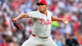 Phillies wait out an extra-inning rain delay, then outlast the Orioles 5-3 in 11