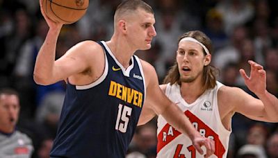 Nikola Jokic of the Denver Nuggets works against Kelly Olynyk of the Toronto Raptors during the second quarter at Ball Arena in Denver on Monday, March 11, 2024.