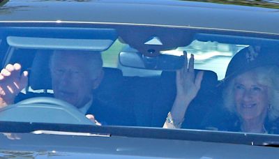 King Charles waves to crowds while driving to church with Queen Camilla