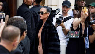 Katy Perry Wears Ripped Tights Over Pumps with No Shirt Under Balenciaga Fur Coat at Paris Couture Week