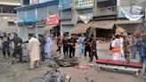 A planted bomb targeting police kills 5 and wounds 20 at a bus stop in northwest Pakistan