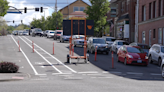 Crews install bike lanes on Holly Street in Bellingham