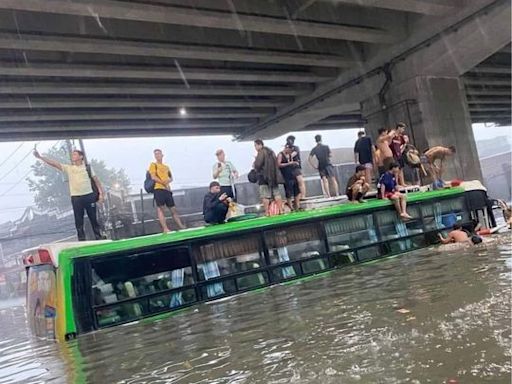 Typhoon triggers flooding in Metro Manila, Bulacan as some residents seek rescue