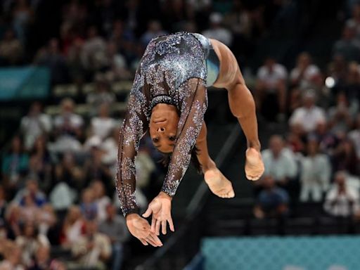 Simone Biles fights through calf injury to produce impressive performance on Olympic return