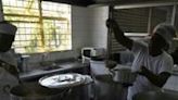 Cooks work at the municipal Burle Marx school's kitchen in Rio de Janeiro, Brazil, on April 4, 2024