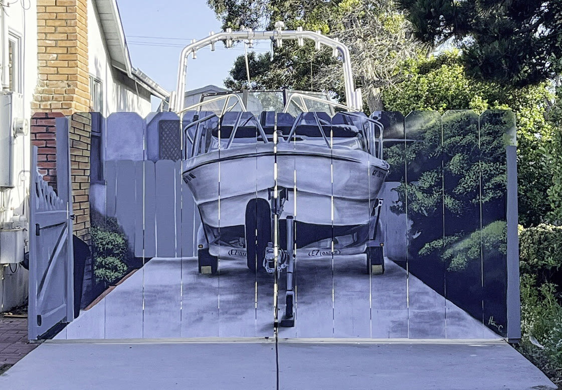 Ordered to put his boat behind a fence, he added a mural that'll make you do a double take