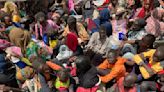 Weary refugees wait in searing heat, hoping Sudan's conflict will end