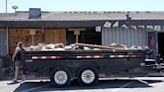 A parked car ends up inside a bar after a crash