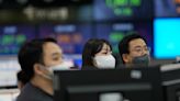 Asian shares extend losses after Wall Street decline