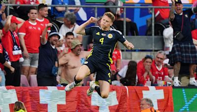 Scotland boost hopes of making it through the group stage with Switzerland draw