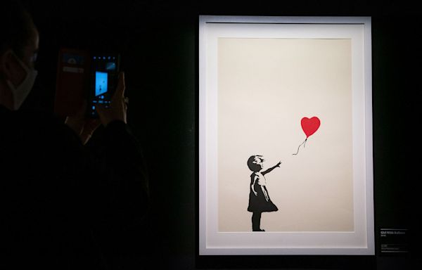 Two charged with stealing Banksy artwork 'Girl with a Balloon' from London gallery