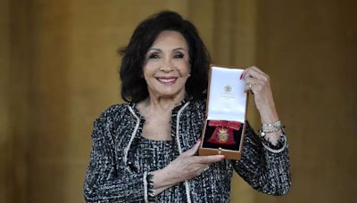 Dame Shirley Bassey breaks protocol and says 'I grabbed him' after receiving Royal honour from King Charles