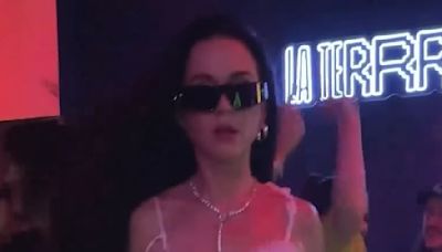 Katy Perry kisses a fan and downs shots at a nightclub in Barcelona