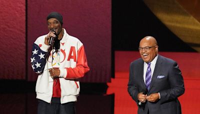 Ready to begin: Snoop Dogg gets in place to broadcast the Olympics