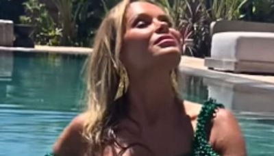 Amanda Holden shows off ageless figure in green bikini in glam poolside video