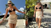 Tripti Dimri soaks in the tropical sun looking fiery in a black bikini paired with white wrap skirt
