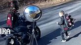 Video: Iredell County student jumps back as motorcyclist speeds by stopped school bus