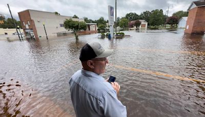 The Latest: A downgraded Debby still threatens with heavy rain and flooding