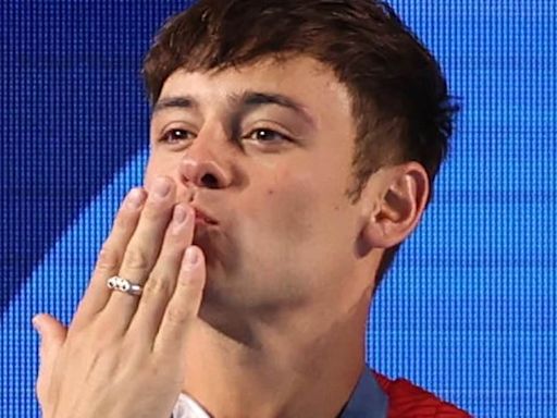 Tom Daley's husband Dustin Lance Black chokes back tears