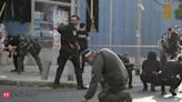 Lebanon's Hezbollah fires dozens of rockets at Israeli kibbutz after drone strike wounds civilians