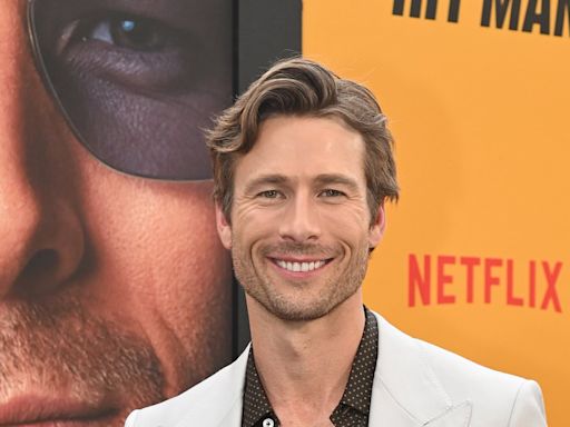 Claims Liam Hemsworth is 'envious' of Glen Powell's success