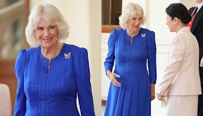 Queen Camilla Favors Sapphire Dress With Exaggerated Shoulders for Final Day of the Emperor and Empress of Japan’s State Visit