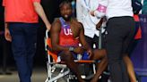 Noah Lyles: US sprinter diagnosed with COVID leaves Paris Olympics track in wheelchair after 200m final