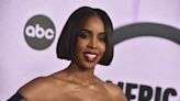 Kelly Rowland tells booing crowd to 'chill out' after Chris Brown wins AMA