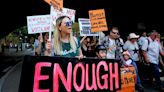 Australians call for tougher laws on violence against women after killings