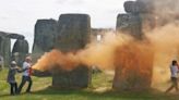 Stonehenge sprayed with orange paint by Just Stop Oil activists demanding U.K. "phase out fossil fuels"