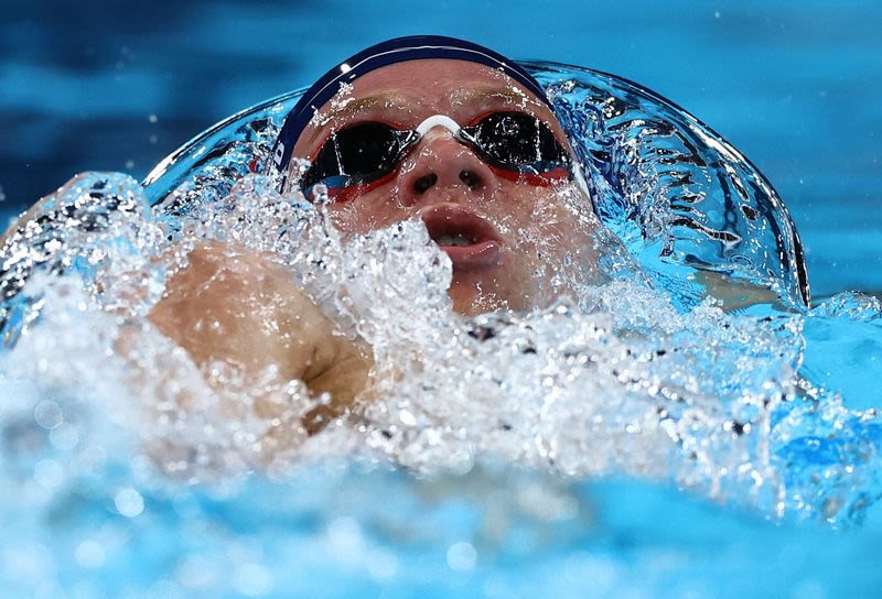 Olympics-Swimming-‘Hurting’ Marchand restarts pool party in 200m individual medley