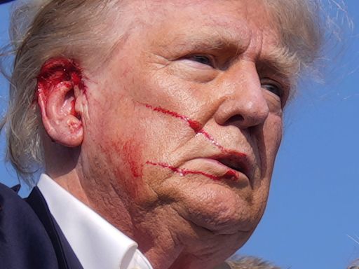 The man who photographed a bloodied and defiant Trump says he 'knew it was a moment in American history that had to be documented'