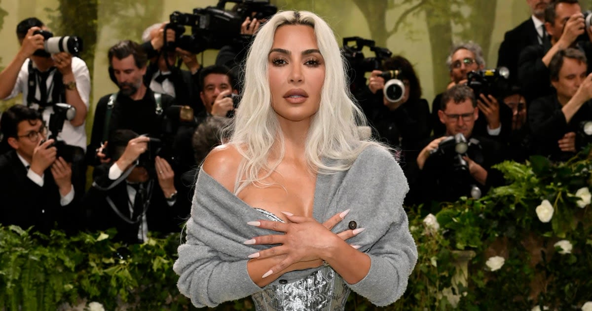 Fans are divided over Kim Kardashian’s Met Gala sweater. She explains why she wore it