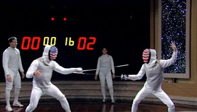 Kelly Ripa and Mark Consuelos duke it out in a round of fencing on 'Live': "I told you, I have terrible aim"