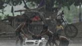 Five dead as freak torrential rains flood Indian capital region, closing schools and offices