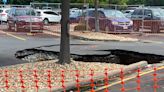 Large sink hole opening up in Walmart parking lot