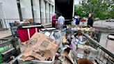 Letter carriers collect food for Caring for Kids