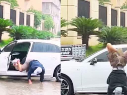 Watch: Man Walks On His Hands In Waterlogged Street To Saves His Shoes - News18