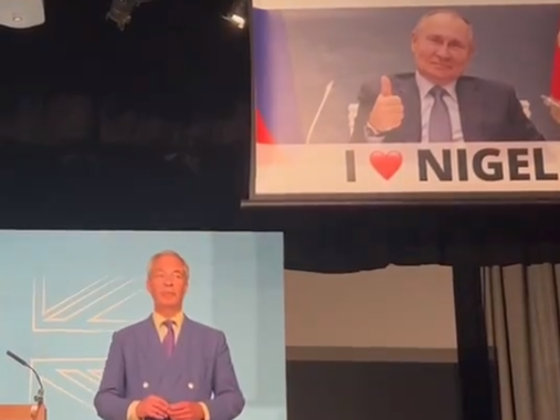 Nigel Farage speech interrupted by banner showing smirking Vladimir Putin