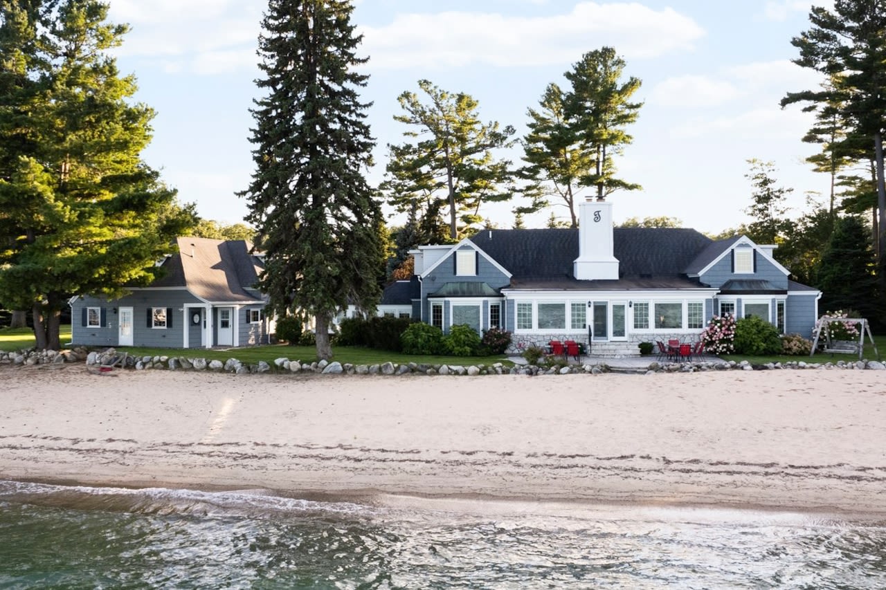 Grand Traverse Bay beach house with 235 feet of sugar sand frontage for sale