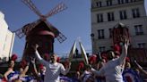 Artists, chefs, garbage collector among hundreds carrying the Olympic torch through Paris