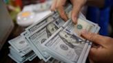 Dollar steady at start of busy week of central bank meetings