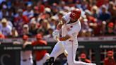 Reds pull out fourth straight win, beat weary Cardinals