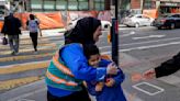 With a vest and a voice, helpers escort kids through San Francisco’s broken Tenderloin streets