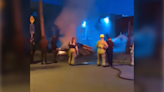 Video shows police officer taking firefighter's hose, spraying people in East Vancouver