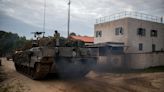 Cash in hand for armored vehicles, Italy weighs its clout in Europe