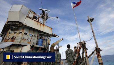 Philippine troops on disputed reef pointed guns at coastguards, China report says