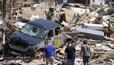 Storms with likely tornadoes slap the Chicago area. Thousands lack power, and 1 is dead